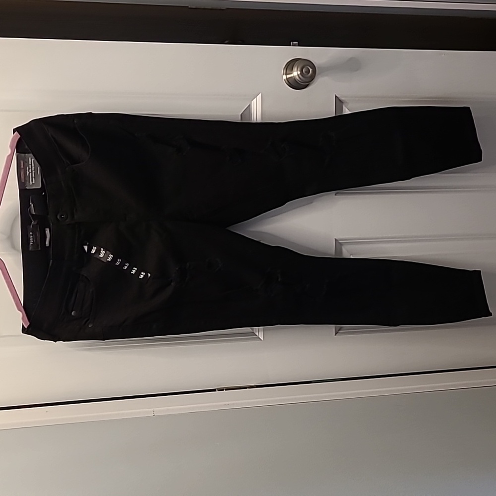 Black distressed skinny jeans.